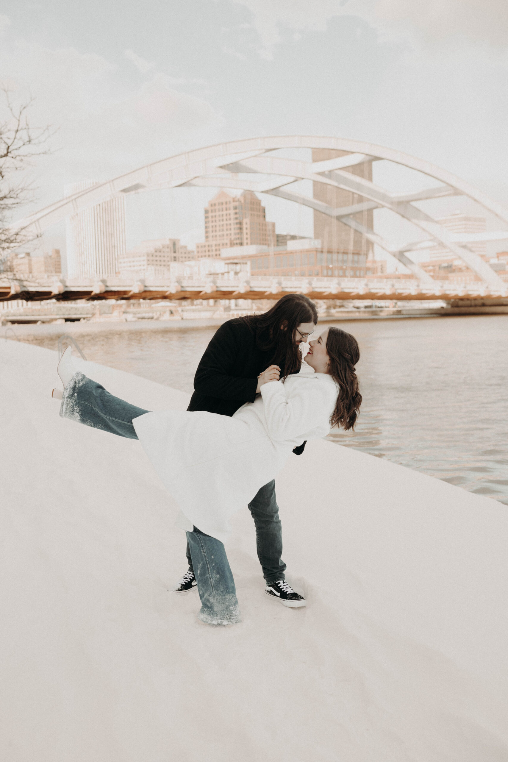 A romantic and magical winter wonderland engagement session in snowy downtown Rochester.